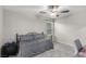 Bright, neutral bedroom featuring a bed, a fan, and a desk at 4220 Porticella Ave, North Las Vegas, NV 89084