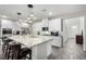 Bright, open kitchen with stainless steel appliances, granite countertops, and stylish pendant lighting at 4220 Porticella Ave, North Las Vegas, NV 89084