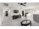 Upstairs living room with cozy carpet, a ceiling fan, and ample natural light at 4220 Porticella Ave, North Las Vegas, NV 89084