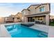 Stunning backyard pool and spa with a covered outdoor dining area, perfect for entertaining guests at 4220 Porticella Ave, North Las Vegas, NV 89084