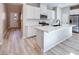 Stylish kitchen with white cabinetry, quartz countertops, and a stainless steel appliance package at 4341 Sunburst Spring Ave, Las Vegas, NV 89141