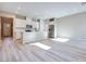 Open-concept kitchen featuring white cabinets, stainless steel appliances, and a large center island at 4341 Sunburst Spring Ave, Las Vegas, NV 89141