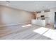 Bright, open-concept living room and kitchen with recessed lighting and wood-look flooring at 4341 Sunburst Spring Ave, Las Vegas, NV 89141