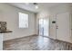 Bright dining area with sliding glass doors and stylish wood-look tile flooring at 4626 Lime Straight Dr, Las Vegas, NV 89115