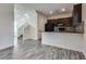 Open-concept kitchen with dark cabinetry and a functional breakfast bar area at 4626 Lime Straight Dr, Las Vegas, NV 89115