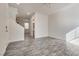 An empty living room features hard surface floors, fresh paint, and a nearby bathroom at 4626 Lime Straight Dr, Las Vegas, NV 89115