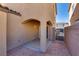 A covered patio provides shade with access to the backyard and a stone wall at 4626 Lime Straight Dr, Las Vegas, NV 89115