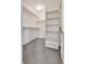 Spacious walk-in closet with carpet flooring and multiple shelving for optimal storage space at 4626 Lime Straight Dr, Las Vegas, NV 89115