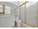 Clean bathroom featuring tile floor, framed mirror, and shower with glass doors at 4716 Mountain Valley Rd, Las Vegas, NV 89121