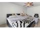 Bright bedroom with tile floor, ceiling fan, and sliding glass doors at 4716 Mountain Valley Rd, Las Vegas, NV 89121