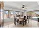 Bright dining area featuring large windows with backyard view and tile flooring at 4716 Mountain Valley Rd, Las Vegas, NV 89121