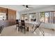 Dining area with tile flooring, large windows, ceiling fan and built in pantry at 4716 Mountain Valley Rd, Las Vegas, NV 89121