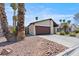 Exterior shot of home with two car garage and desert landscaping at 4716 Mountain Valley Rd, Las Vegas, NV 89121