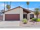 Charming single-story home featuring a two-car garage and desert landscaping at 4716 Mountain Valley Rd, Las Vegas, NV 89121