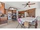 Charming kitchen featuring wood cabinets, brick backsplash, stainless appliances, and adjacent dining area at 4716 Mountain Valley Rd, Las Vegas, NV 89121