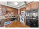 Kitchen with wood cabinets, brick backsplash, and table at 4716 Mountain Valley Rd, Las Vegas, NV 89121