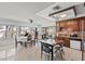 Spacious kitchen and dining area with brick backsplash and stainless-steel appliances at 4716 Mountain Valley Rd, Las Vegas, NV 89121