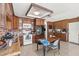 Well-lit kitchen featuring wood cabinets, brick backsplash, stainless appliances, and adjacent dining table at 4716 Mountain Valley Rd, Las Vegas, NV 89121