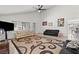 Open living room with tile flooring, ceiling fan and lots of natural light at 4716 Mountain Valley Rd, Las Vegas, NV 89121