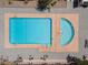 Aerial shot of a sparkling blue swimming pool and spa area with surrounding lounge chairs at 4716 Mountain Valley Rd, Las Vegas, NV 89121