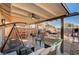 Outdoor view of a covered patio area, furnished with a swing and seating, perfect for relaxing at 4815 Palacio Ct, Las Vegas, NV 89122