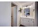 Stylish bathroom features a sleek vanity with modern fixtures and a large mirror at 4815 Palacio Ct, Las Vegas, NV 89122