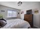 Bright bedroom with a window, dresser, and comfortable bedding, creating a cozy retreat at 4815 Palacio Ct, Las Vegas, NV 89122