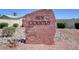 Community welcome sign amidst desert landscaping and privacy fencing at Sun Country at 4815 Palacio Ct, Las Vegas, NV 89122