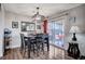 Charming dining room features dark wood table, modern light fixture, and access to a backyard patio at 4815 Palacio Ct, Las Vegas, NV 89122