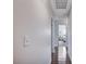 Hallway with sleek wood floors leading to a bedroom, showcasing the home's layout at 4815 Palacio Ct, Las Vegas, NV 89122