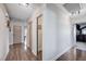 Hallway showcasing hardwood floors, neutral walls, and multiple doorways, with access to bedrooms at 4815 Palacio Ct, Las Vegas, NV 89122