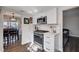 Well-lit kitchen with stainless steel appliances, modern white cabinets, and views into the dining area at 4815 Palacio Ct, Las Vegas, NV 89122