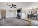 Spacious living room with wood and carpet flooring and an open floorplan at 4815 Palacio Ct, Las Vegas, NV 89122