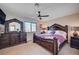 Comfortable main bedroom features a large bed with decorative headboard and matching dresser at 4815 Palacio Ct, Las Vegas, NV 89122