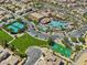 Aerial view of community with large pool, tennis courts, basketball court and green space at 500 Via Stretto Ave, Henderson, NV 89011