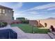 The backyard features artificial grass, a brick-paved patio, desert landscaping, and a view of the mountains at 500 Via Stretto Ave, Henderson, NV 89011