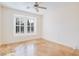 Neutral bedroom featuring stained concrete floors and plantation shutters at 500 Via Stretto Ave, Henderson, NV 89011