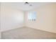 Carpeted bedroom featuring neutral colored walls and a window with shutters at 500 Via Stretto Ave, Henderson, NV 89011