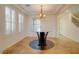 Formal dining room with tray ceiling, designer light fixture and plantation shutters at 500 Via Stretto Ave, Henderson, NV 89011