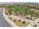 Community entrance with desert landscaping, golf course views, and stone signage at 500 Via Stretto Ave, Henderson, NV 89011