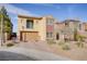 Charming two-story home featuring desert landscaping and a brick paved driveway at 500 Via Stretto Ave, Henderson, NV 89011