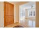 Welcoming foyer with tiled floors, wood door, and natural light at 500 Via Stretto Ave, Henderson, NV 89011