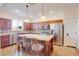 Gourmet kitchen featuring an oversized island, stainless steel appliances and custom cabinetry at 500 Via Stretto Ave, Henderson, NV 89011