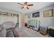 Bright bedroom with ample storage and ceiling fan at 5205 Mantua Ct, Las Vegas, NV 89130