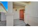 Red front door entry with a small covered porch at 5205 Mantua Ct, Las Vegas, NV 89130