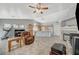 Open kitchen with wood cabinets, an island, and a view into the living area at 5205 Mantua Ct, Las Vegas, NV 89130