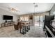 Living room showcasing an open floor plan with a fireplace and sliding doors at 5205 Mantua Ct, Las Vegas, NV 89130