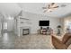 Bright living room with a fireplace and large windows, offering a comfortable atmosphere at 5205 Mantua Ct, Las Vegas, NV 89130