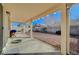 Covered patio with a gravel yard and grill at 5205 Mantua Ct, Las Vegas, NV 89130