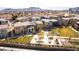 Neighborhood aerial view showcasing modern home design and community park, with mountains in background at 546 Foothill Cove Ln, Henderson, NV 89002